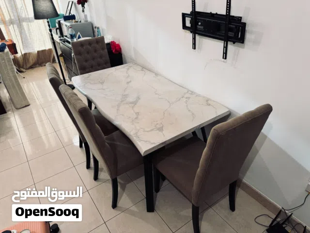 Dinning Table Set with 4 cushioned wooden chairs - 250 AED