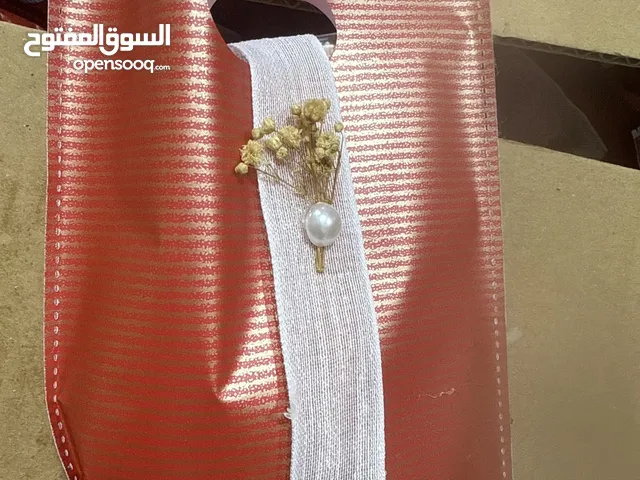 توزيعات حفلات مكونه من شمعه صدفيه و علاقه مفاتيح مصنوعه يدويا