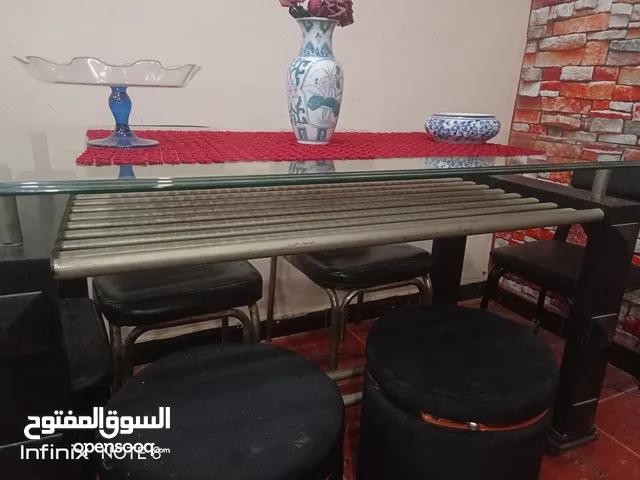 ترابيزة زجاج×الوميتال دورين والرجول خشب