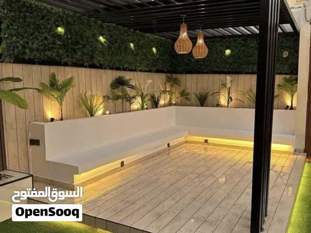 تنسيق حدائق تركيب التيل الجداري وبديل الخشب