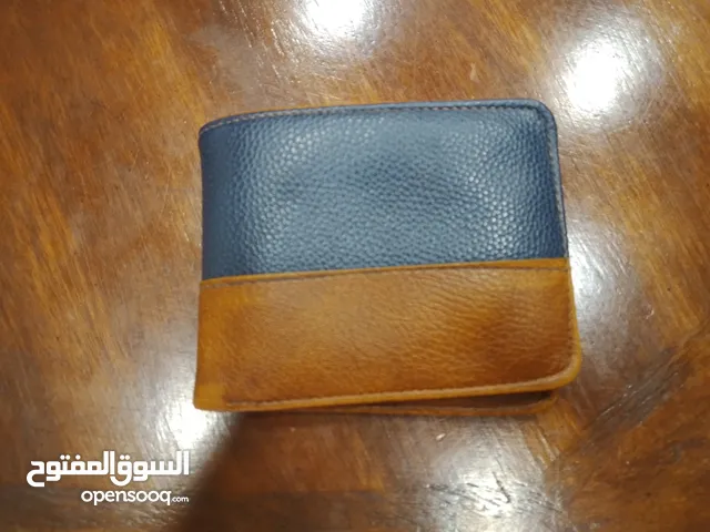 محفظة جلد اصلي ب دينار 1