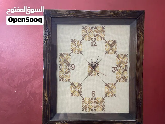 ساعه حائط مطرزة تطريز يدوي