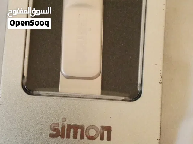 This object appears to be a Simon-branded USB flash drive, likely intended as a promotional item. Th