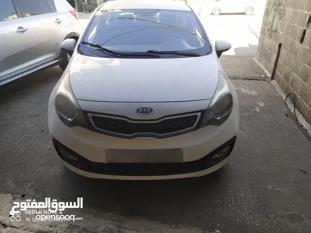 كيا ريو/ترخيص 2014/جير عادي فحص كراتين/شمامه بنزين
