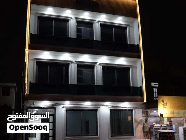 بنايه في الشعله حي الجوادين مقابل بلديه الشعله شارع تجاري