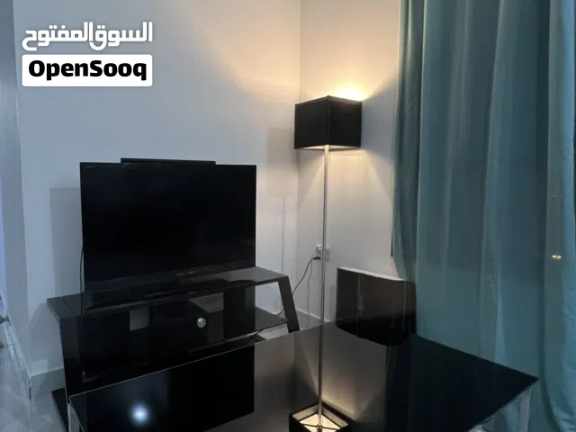 Set of Tv with stand and a coffee table