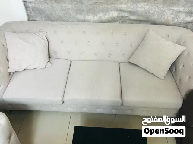 Elegant Beige Sofa With Cushions