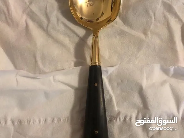 معالق وشوكه طعام مطلى ذهب ويد عاج اسود