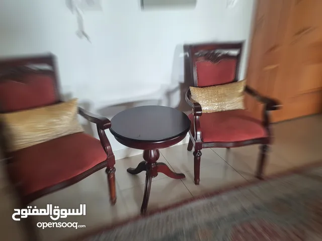 Tow chairs with round table