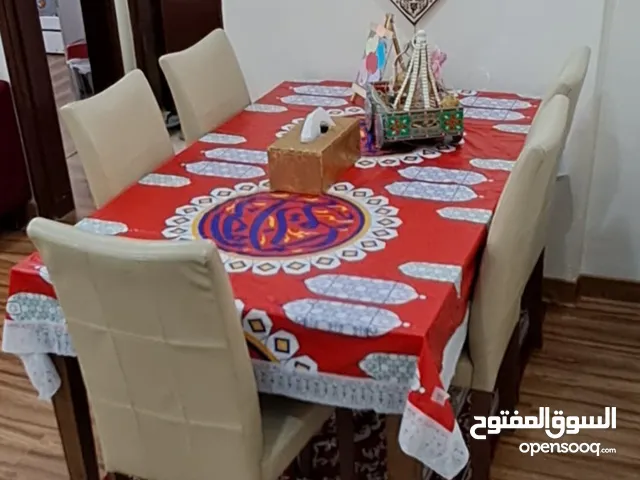 Safat Home Teakwood dining table with 5 beautiful leather chairs for sale in just KD 40.