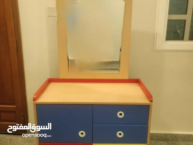 two single bed without mattress and tabel with mirror