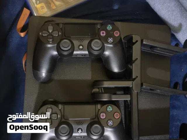 PS4 SLIM - 1TB WITH 2 CONSOLE AND GTA AND CONTROLLER HOLDER WITH BOX