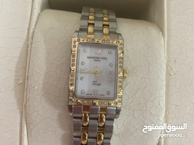 A Raymond Weil silver and gold ladies watch with 40 small carat diamonds.Its only been used once.