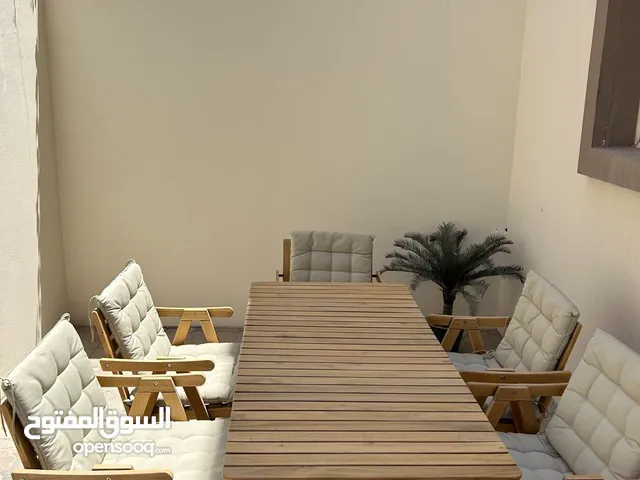 IKEA table with 5 chairs with cushions