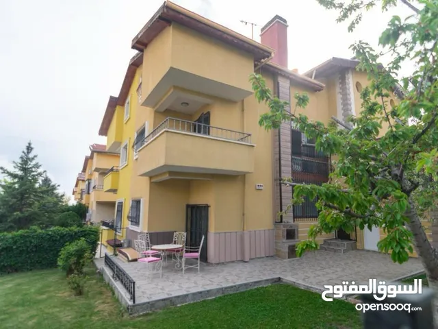 A practical corner villa in Ankara with a private garden and a garage