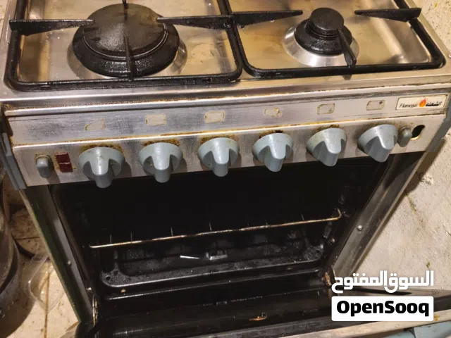 طباخ بتجاز اربعه شعله وفرن مع المنظم وخرطوم الغاز