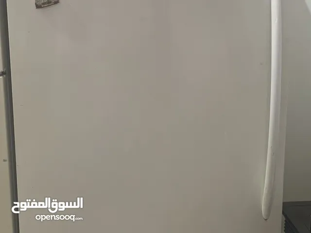 A white westing house upright freezer like new with fridge Daewoo