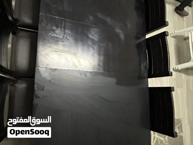 طاولة سفرة خشب زان لون اسود + 10 مقاعد ارضية جلد لون اسود