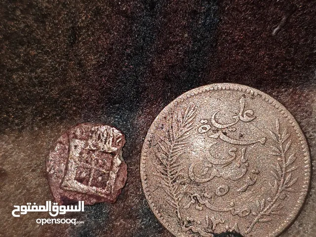 عملة تونسية من عهد البايات و عملة رومانيا