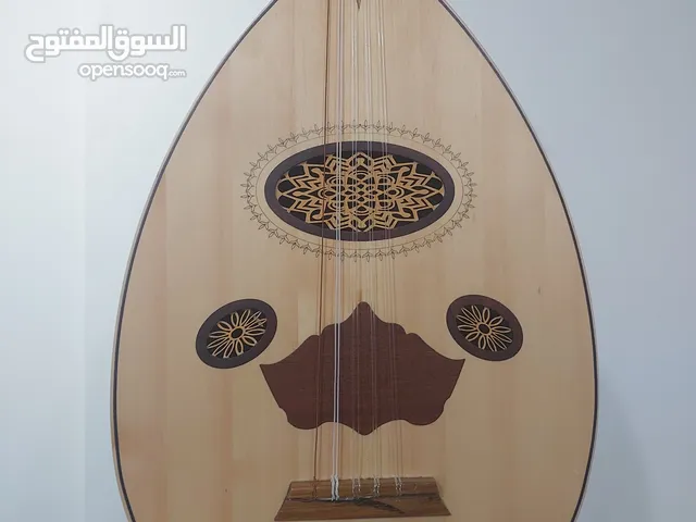 عود شرقي جديد فاخر مع 2ريشه و شنطة وطقم أوتار