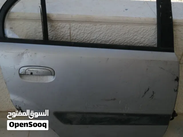 قطع كيا ريو 2006-2011 باب خلفي يمين و شل امامي ومرايا جانبية و شل امامي سفلي وقاعدة محرك اليمين