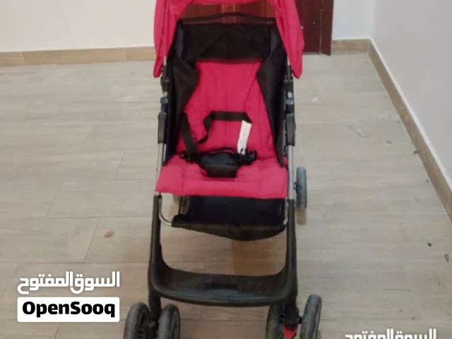 ترولي للأطفال بلون الاحمر و الأسود لااعمل ما الماركة(مستعمل)