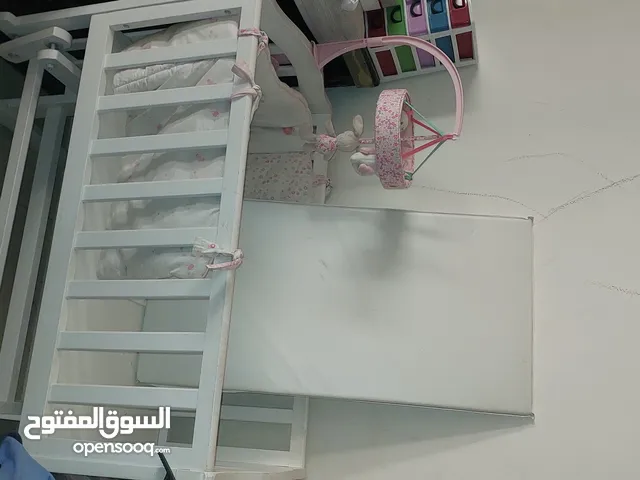 Baby Crib/Bed for your little ones with a mattress and edge protector Rarely used so it's like new