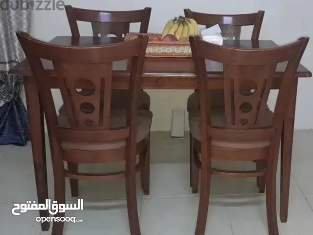 Dining table and four chairs for 30 bd