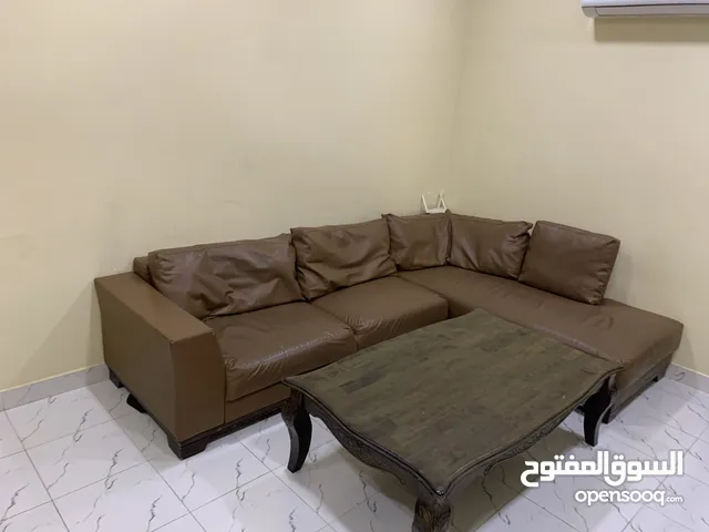 L shape sofa with table