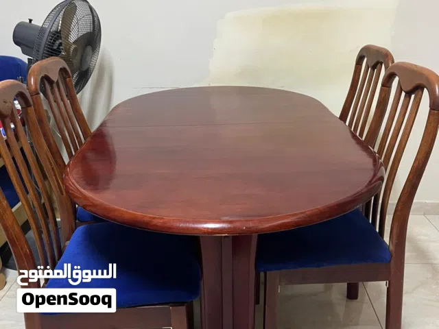 Expandable dining table with 6 chairs