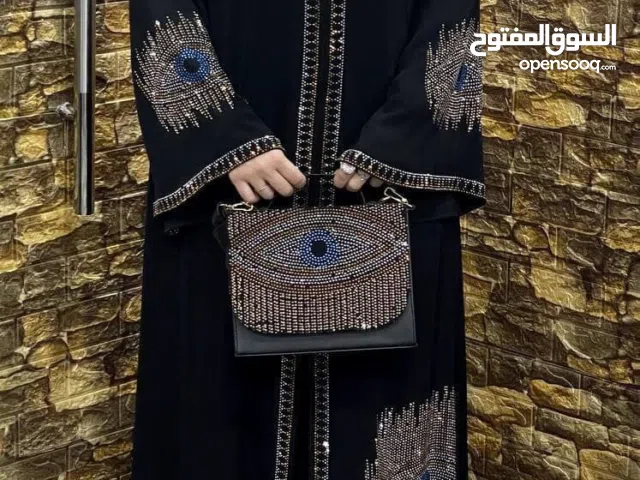 عباي حرير كوري مع شنطه 200درهم