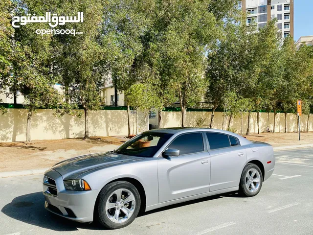A Very Well Maintained DODGE CHARGER 2014 SILVER GCC SXT Edition With Sunroof