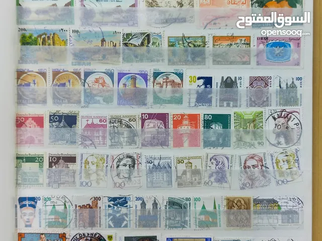 البوم طوابع منوع يحتوي على طوابع عربية (الكويت - عمان ....) و اجنبية / 12 صفحة