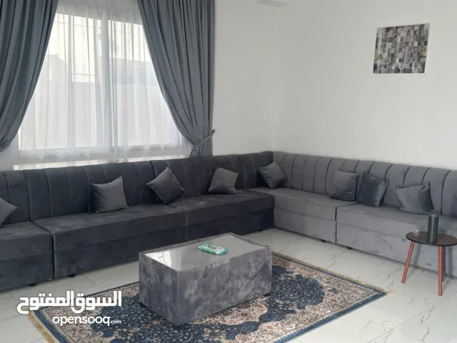 Complete living room set including curtains, a center table, a TV stand, and new curtains and rugs.