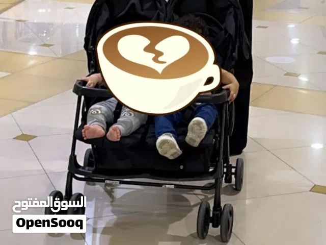 عربة اطفال توام