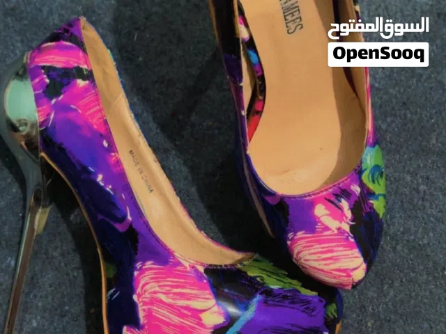 Purple With Heels in Amman
