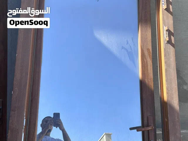 باب PVC  خشبي بالقفص متاعه