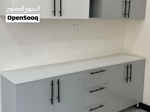 كاونتر خشب ام دي اف بأجمل التصاميم قياس مترين ارضي وملحق مترين  مع سنك متر و عشرين سم مرمر