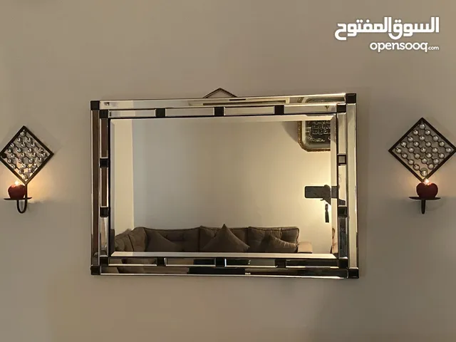 Elegant mirror with two candle holders