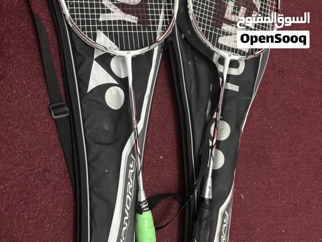 Two badminton rackets