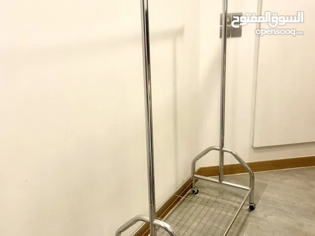 a rolling metal clothes rack,