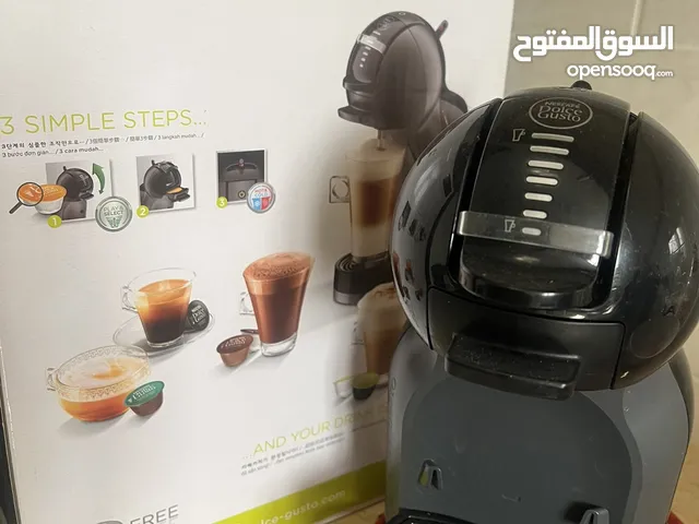 ماكينة dolce gusto الأصلية من الغانم لصنع القهوة بجميع أنواعها ( بارد وسخن) بحالة جيدة جدا
