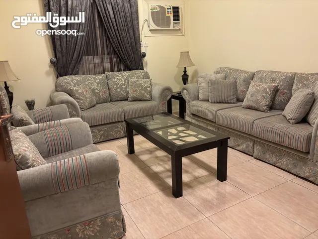 9 seater sofa , ottoman , two small table and curtains for urgent sale . moving out in a week