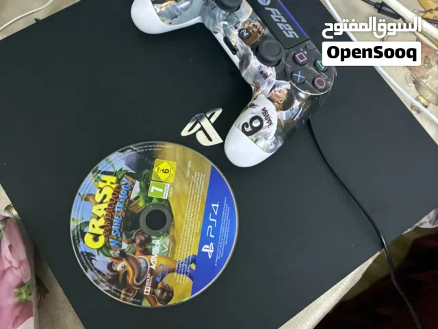 A barley used ps4 pro 1 terabyte 2 controllers and a charger