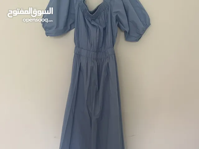 Off the shoulder blue maxi dress with cutout in the back
