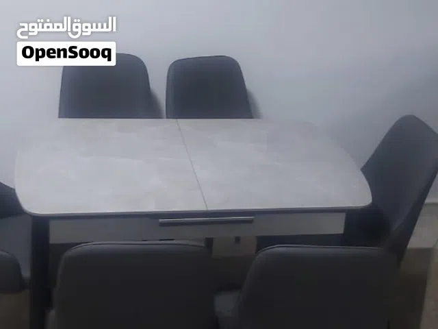طاولة سفرة رخام مع 6 كراسي قابلة للفتح