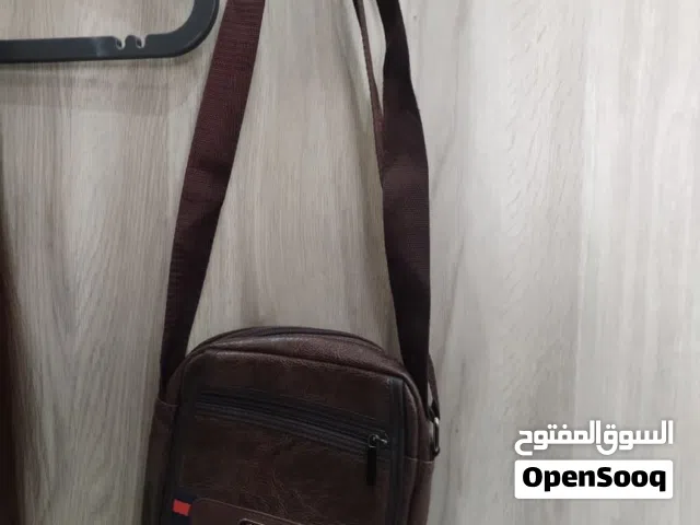 شنط للبيع ستوك مستعمل البنيه موجود منها 2