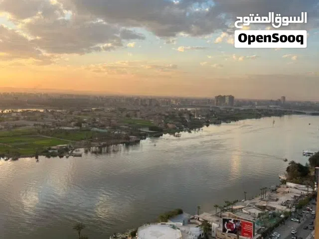 وحدة فندقية بـ إطلالة على النيل والاهرامات