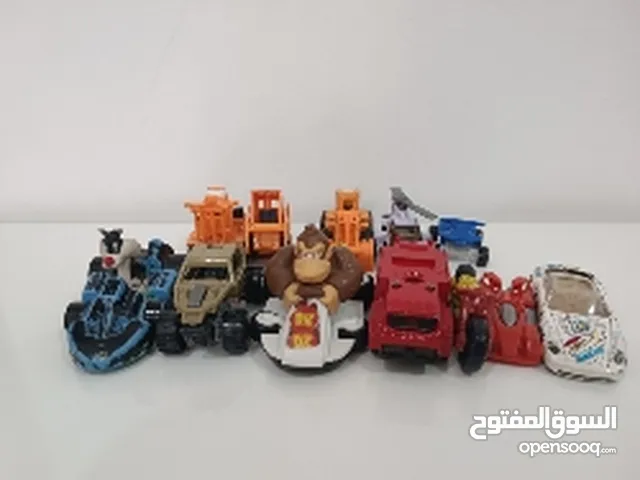 11 toy cars and 1 helicopter toy