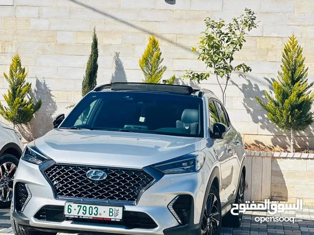 هيونداي توسان (N-Line) 2021 فُل أوبشن للبيع، لون فضي مُميز ، حالة وكالة ، ماشي 50000 ترخيص وتأمين.